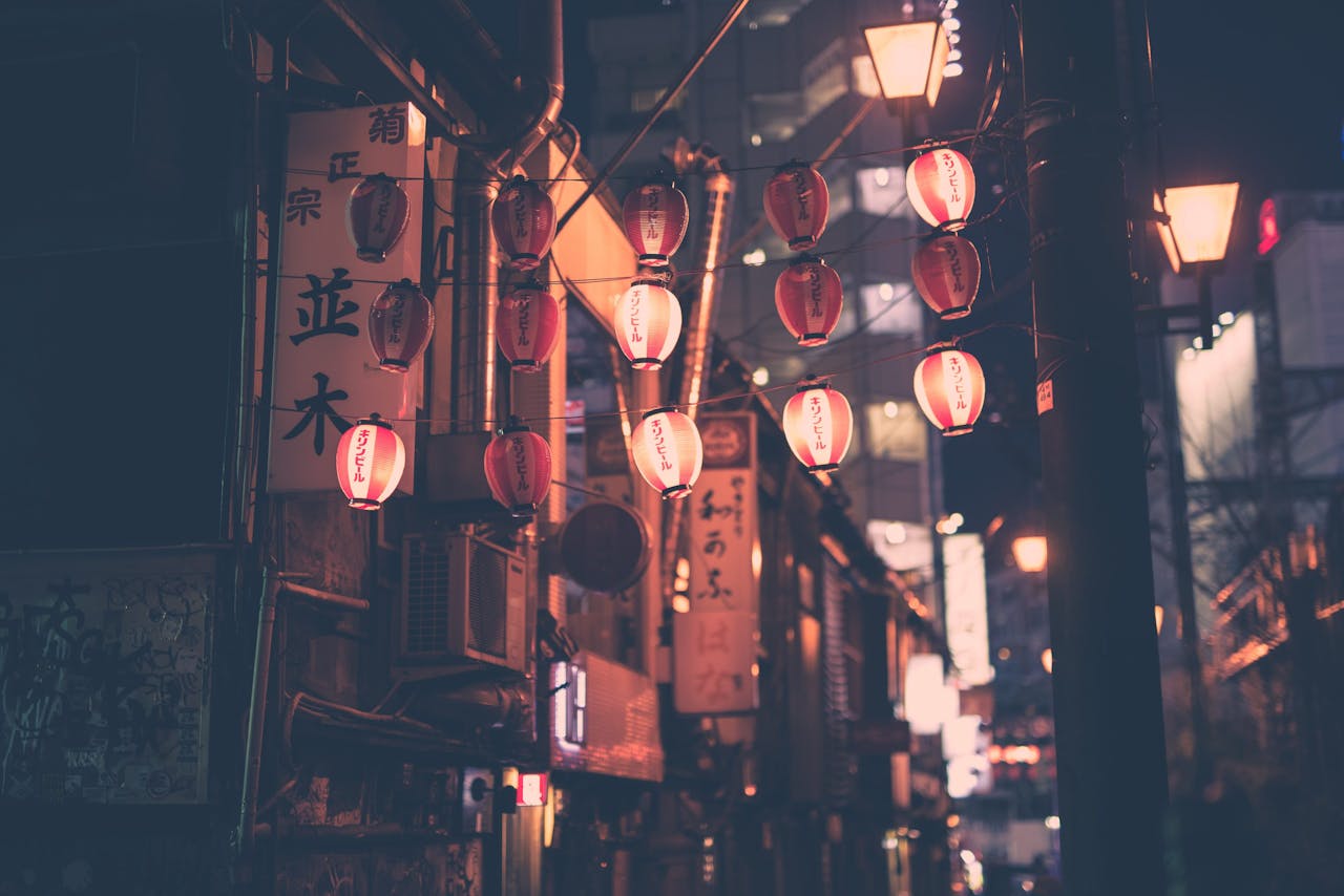 Moody night street with red lanterns in Tokyo Japan, capturing urban charm and cultural essence.